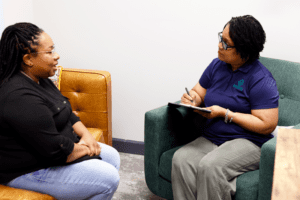 Two women speaking in therapy office